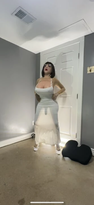 Hot trans cd in cute white dress teasing huge tits and ass
